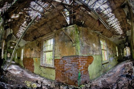 Pale green corridor intersection, with windows, derelict Hellingly Asylum, West Sussex