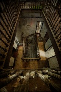 View downstairs, with bannisters, derelict Manor House 'B', Norfolk, UK