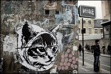 Street art in East London, cat face in paper