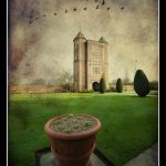 Gate tower at Sissinghurst Castle, Kent, with plant pot and topiary