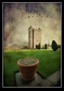 Gate tower at Sissinghurst Castle, Kent, with plant pot and topiary