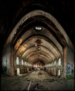 The stage in the hall, with street art, derelict Hellingly Asylum, West Sussex