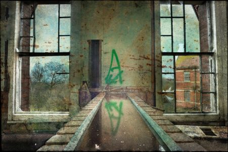 Windows and water reflection, derelict Hellingly Asylum, West Sussex