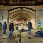 Multiplicity portrait on the stage in the hall, with street art, derelict Hellingly Asylum, West Sussex